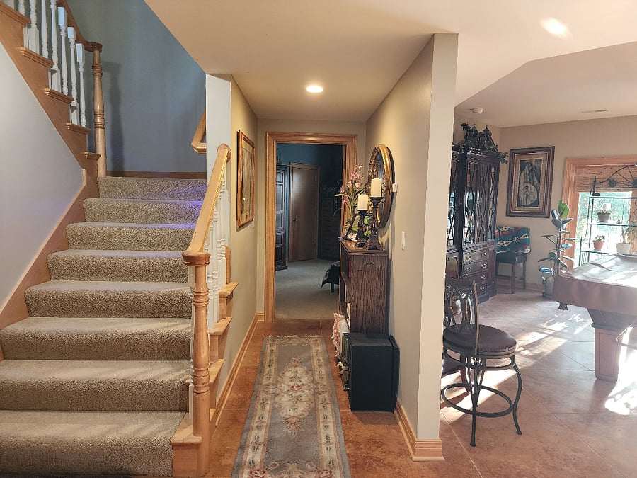 Stairs and hall to Futon Bunkbed room and Beatifully furnished living entertainment area