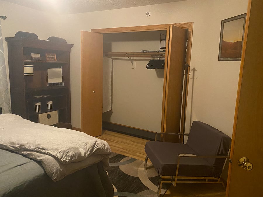 Photo of other side of room, ceiling fan and area rug, chairs - not in photo