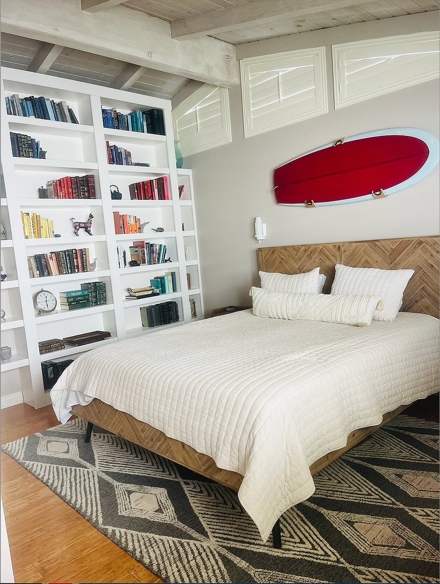 Generously sized master bedroom with large closet and beamed ceiling. This room also has a split unit for heating/AC.