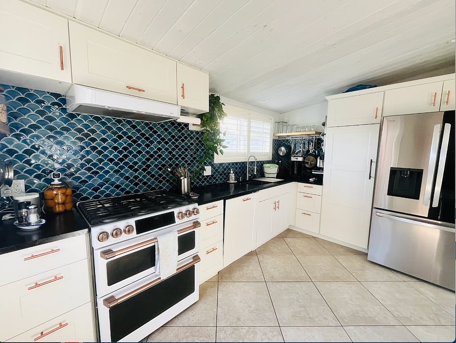 Fully stocked kitchen with lots of light.