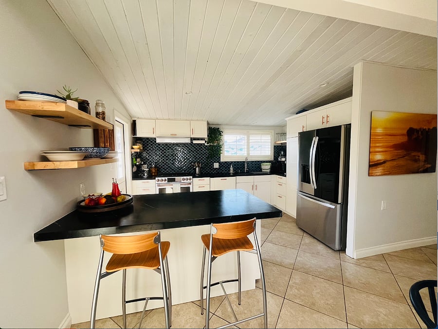 Open concept kitchen opens to light filled courtyard.
