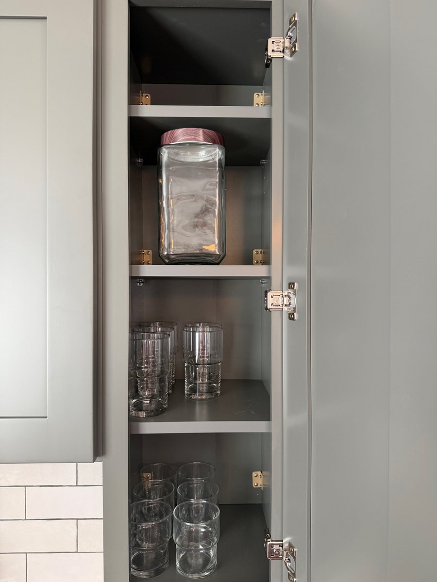 Interior view of cabinets with kitchen items