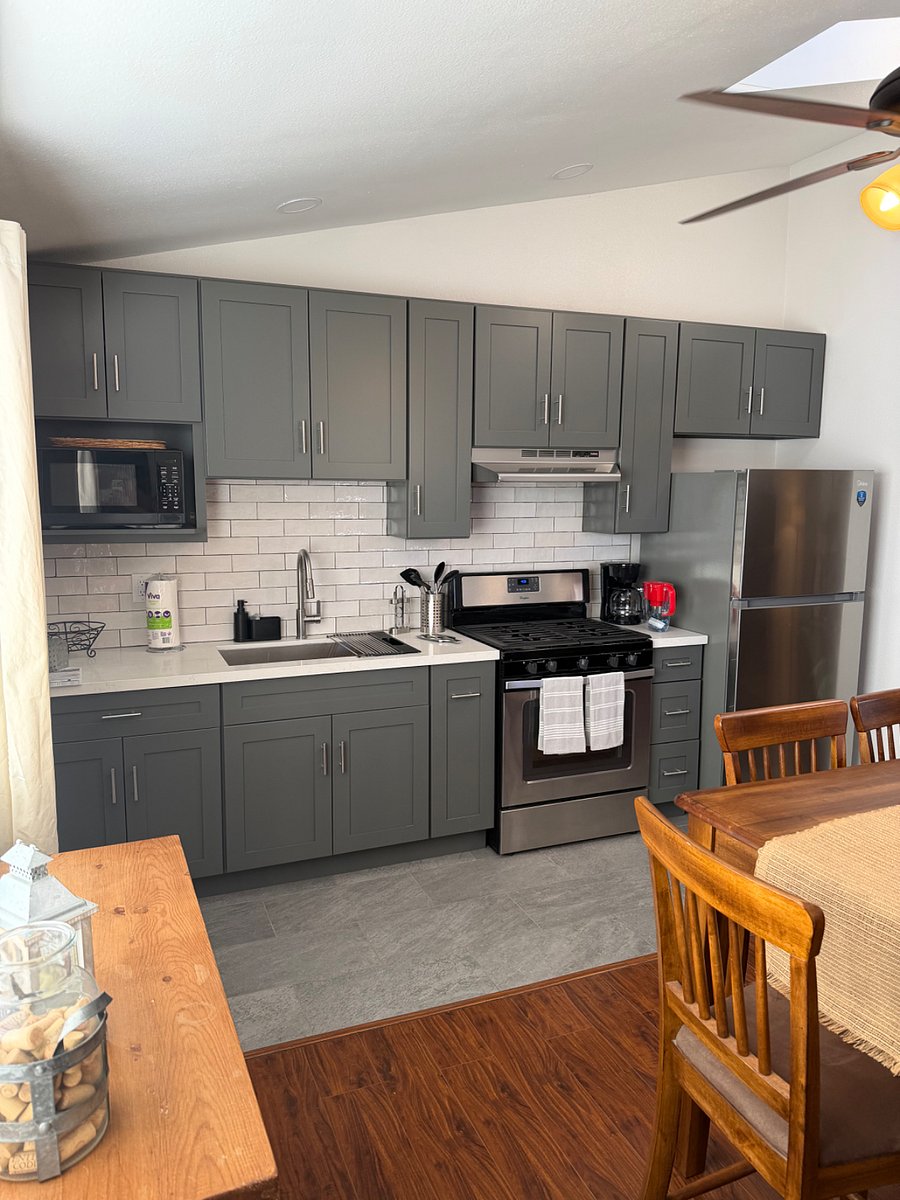 View of the fully functioning kitchen from the dining room angle 