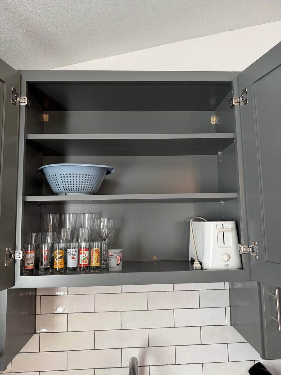 Interior view of cabinets with kitchen items
