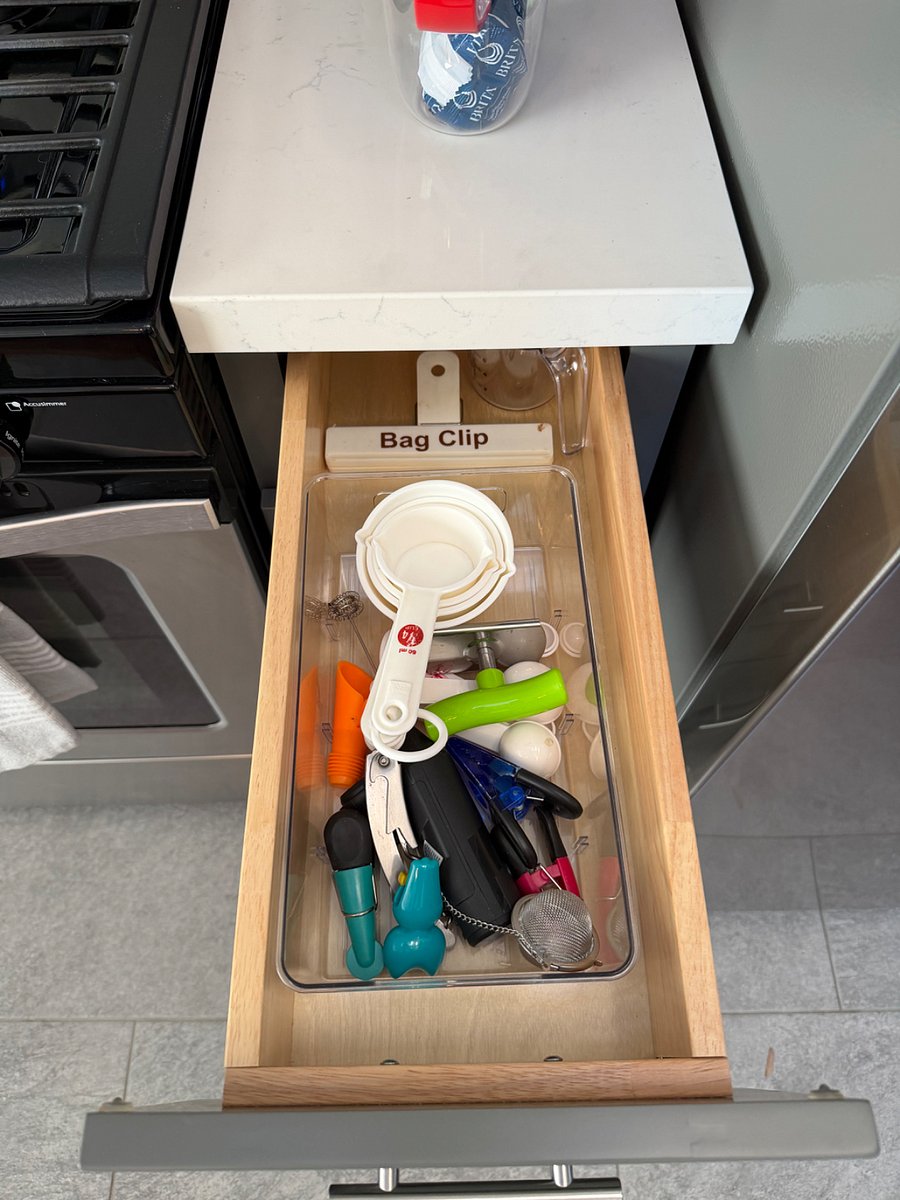 Interior view of cabinets with kitchen items