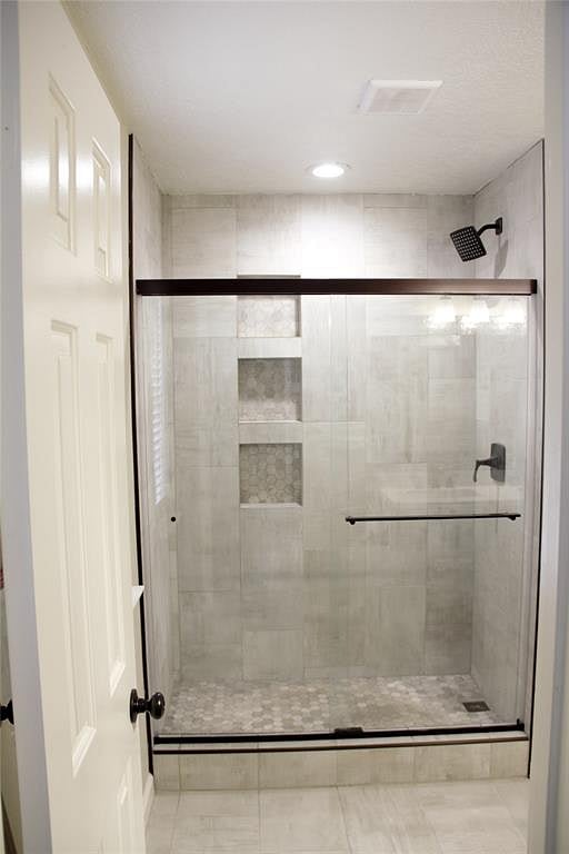 Tile walk in shower.