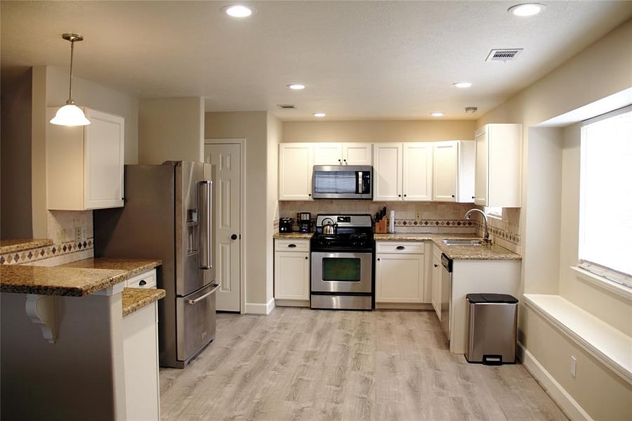 Custom kitchen with stainless steel appliances