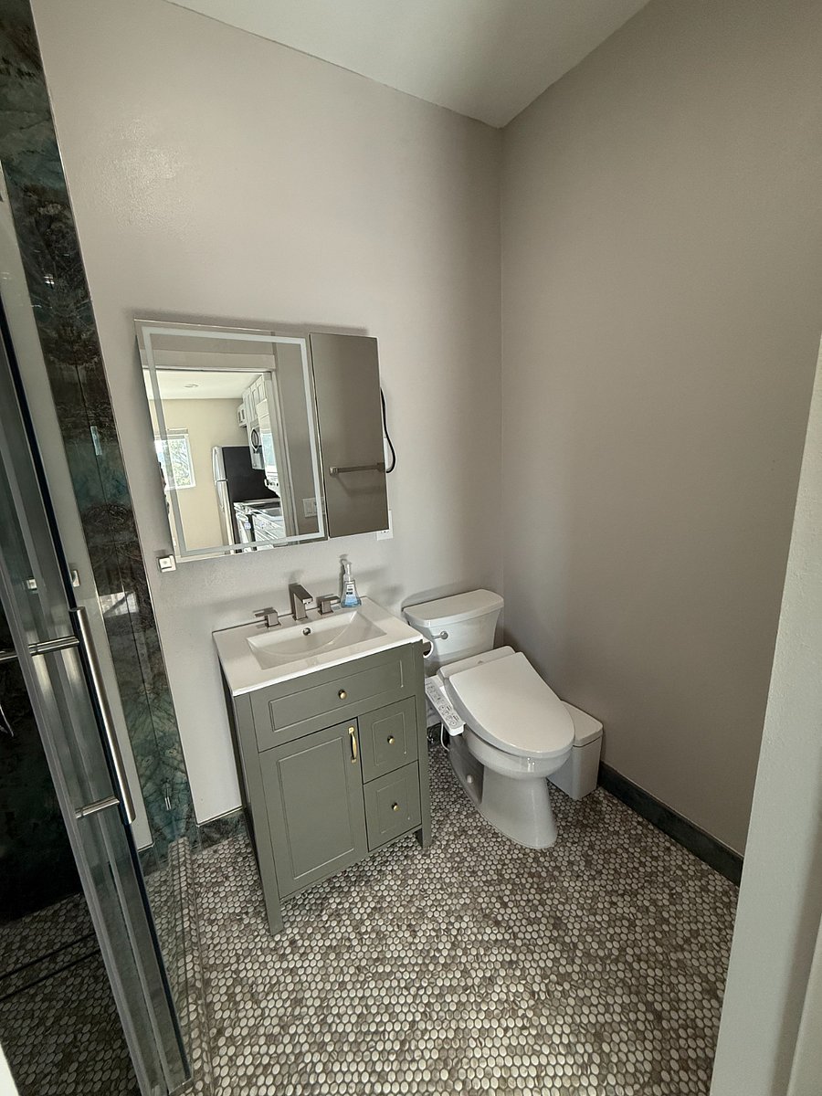 Smart toilet - Bidet.
Vanity and Medicine cabinet featuring outlets for hair iron and charges.