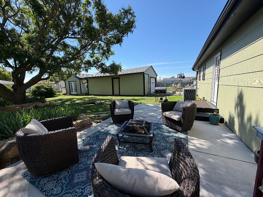 Backyard patio with seating and firepit