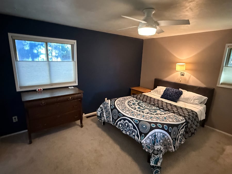 Master bedroom, with its ceiling fan and dark accent walls make it an absolute sleeping retreat like no other!