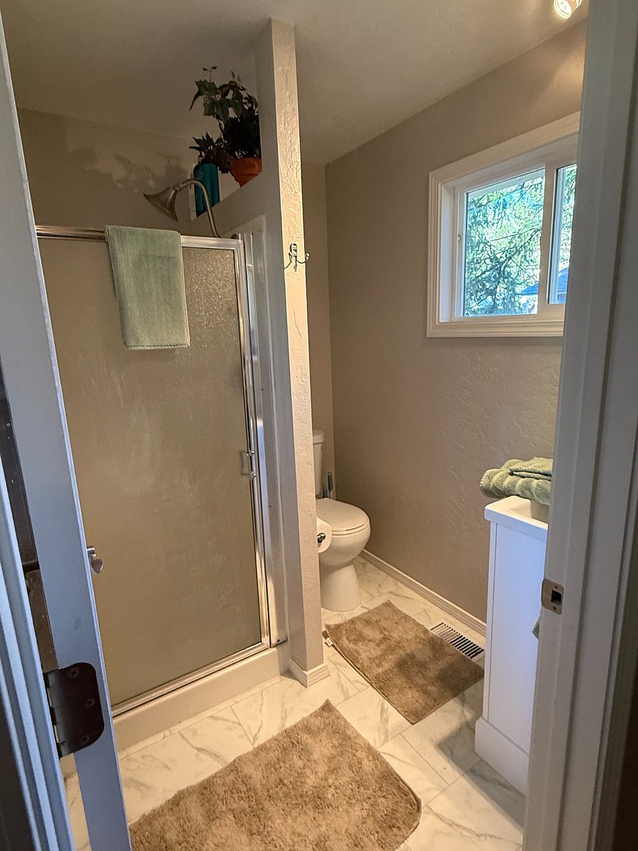 Master bath with shower (shampoo, conditioner and body wash provided)