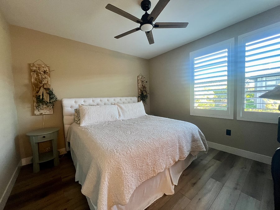 King in master with Pottery Barn headboard, upgraded bedding, wood shutters and ceiling fan.