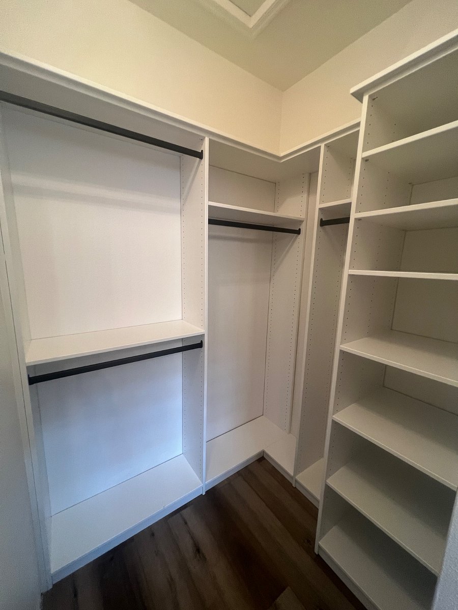 Lots of storage in guest room closet with build in shelves
