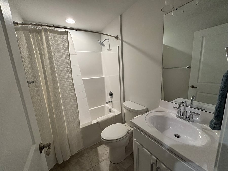 Full bath with shower and bathtub downstairs