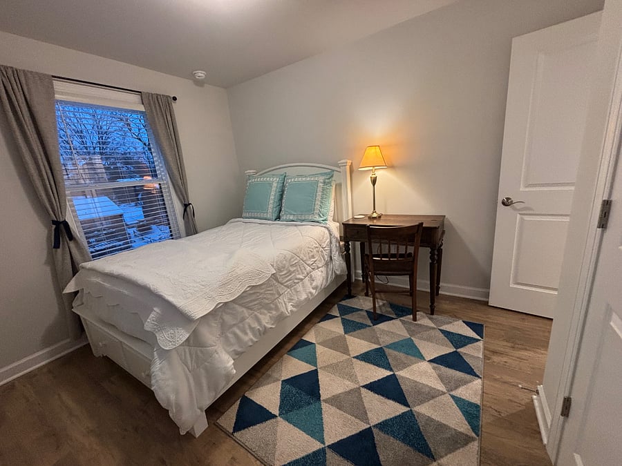 Upstairs bedroom with double bed and large closet