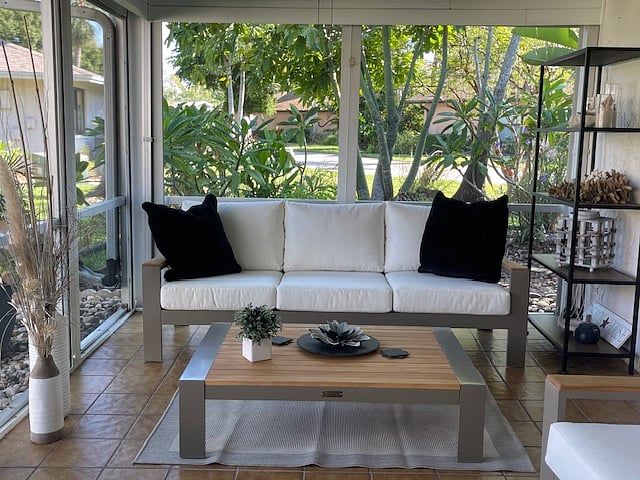 Lanaii with view of garden
Club chairs and 4 seated table