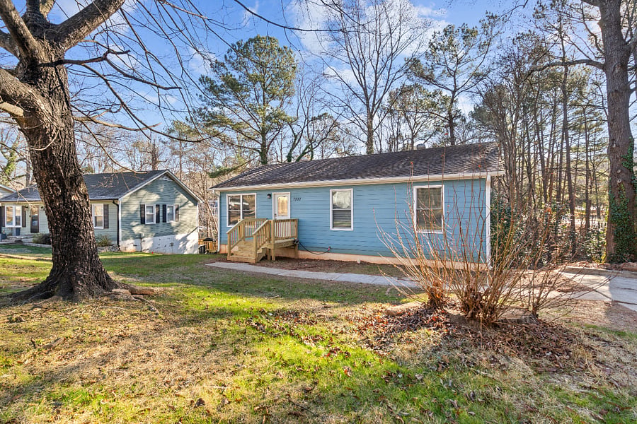 Corner lot with parking in driveway and on street.