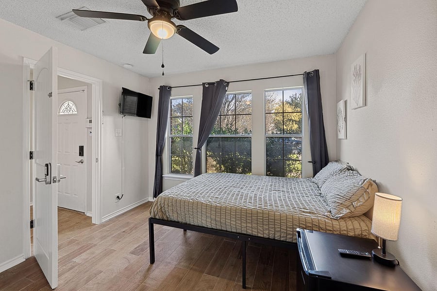Bedroom large windows to bring in natural light.