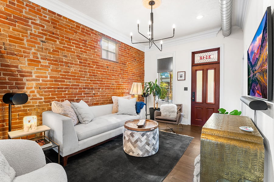 Living room on the main level with view of the front door