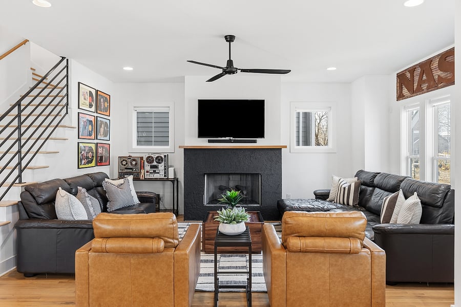 Modern, cozy living room with a gas fireplace, sleeper sofa and a Smart TV with all the streaming apps.