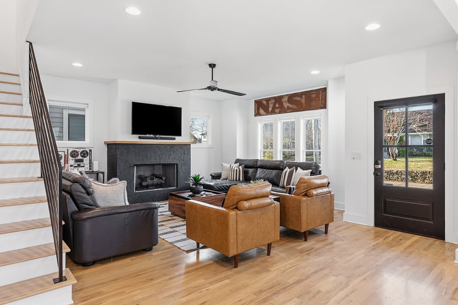 Modern, cozy living room with a gas fireplace, sleeper sofa and a Smart TV with all the streaming apps.