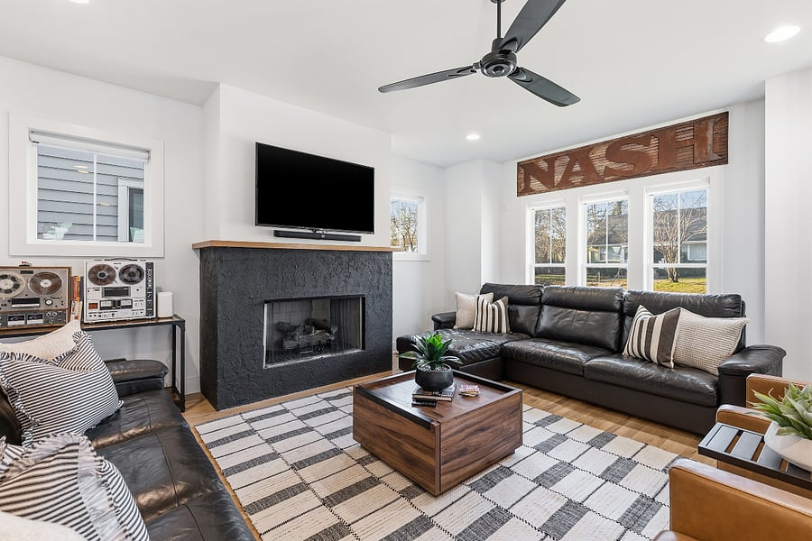 Modern, cozy living room with a gas fireplace, sleeper sofa and a Smart TV with all the streaming apps.