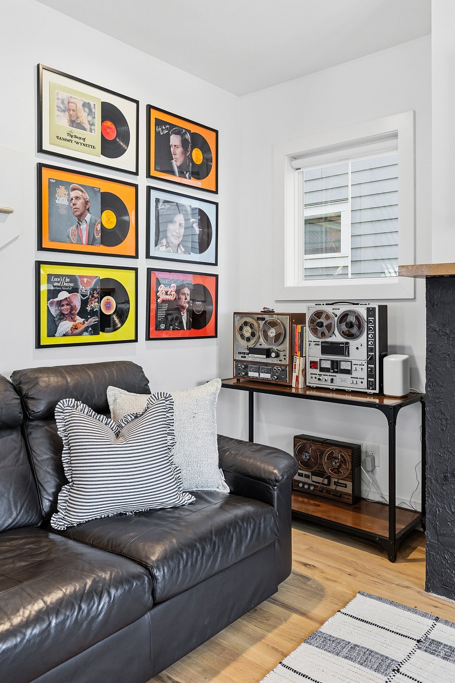 Modern, cozy living room with a gas fireplace, sleeper sofa and a Smart TV with all the streaming apps.