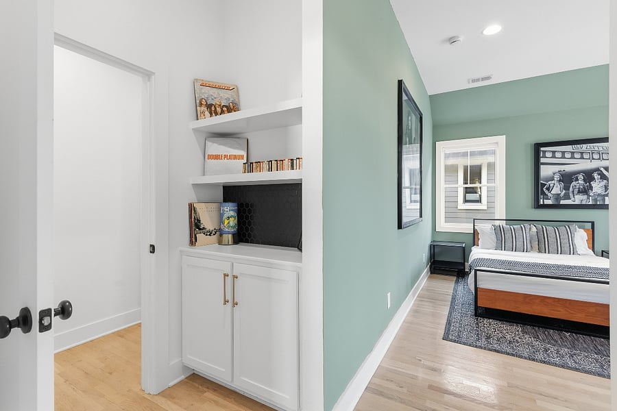 Bedroom 2 includes a queen and king bed, two accent chairs, and a smart TV with access to all the streaming apps. It also has a huge walk-in closet and large ensuite bathroom.
