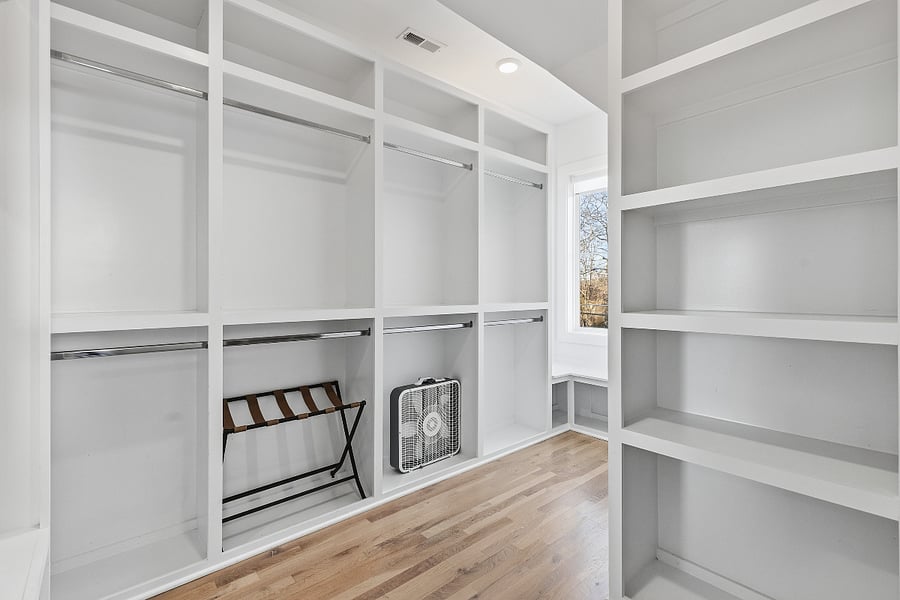 Bedroom 2 includes a queen and king bed, two accent chairs, and a smart TV with access to all the streaming apps. It also has a huge walk-in closet and large ensuite bathroom.
