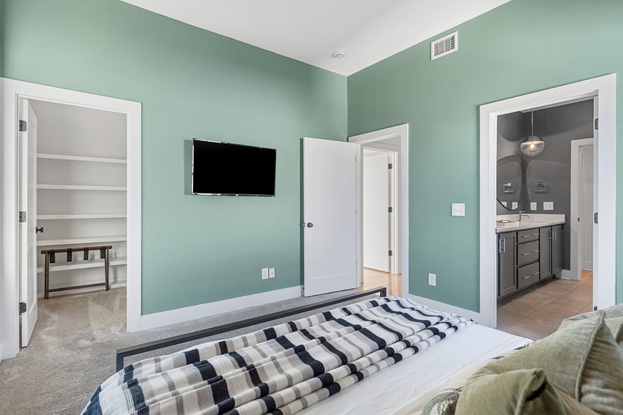 Primary bedroom with king-sized bed and ensuite full bathroom. Located on the 2nd floor.