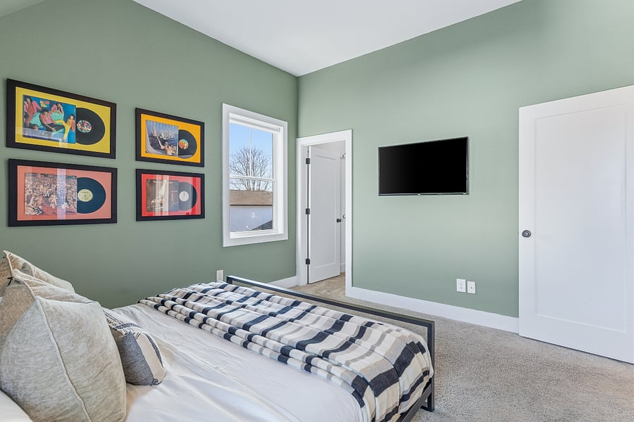 Primary bedroom with king-sized bed and ensuite full bathroom. Located on the 2nd floor.