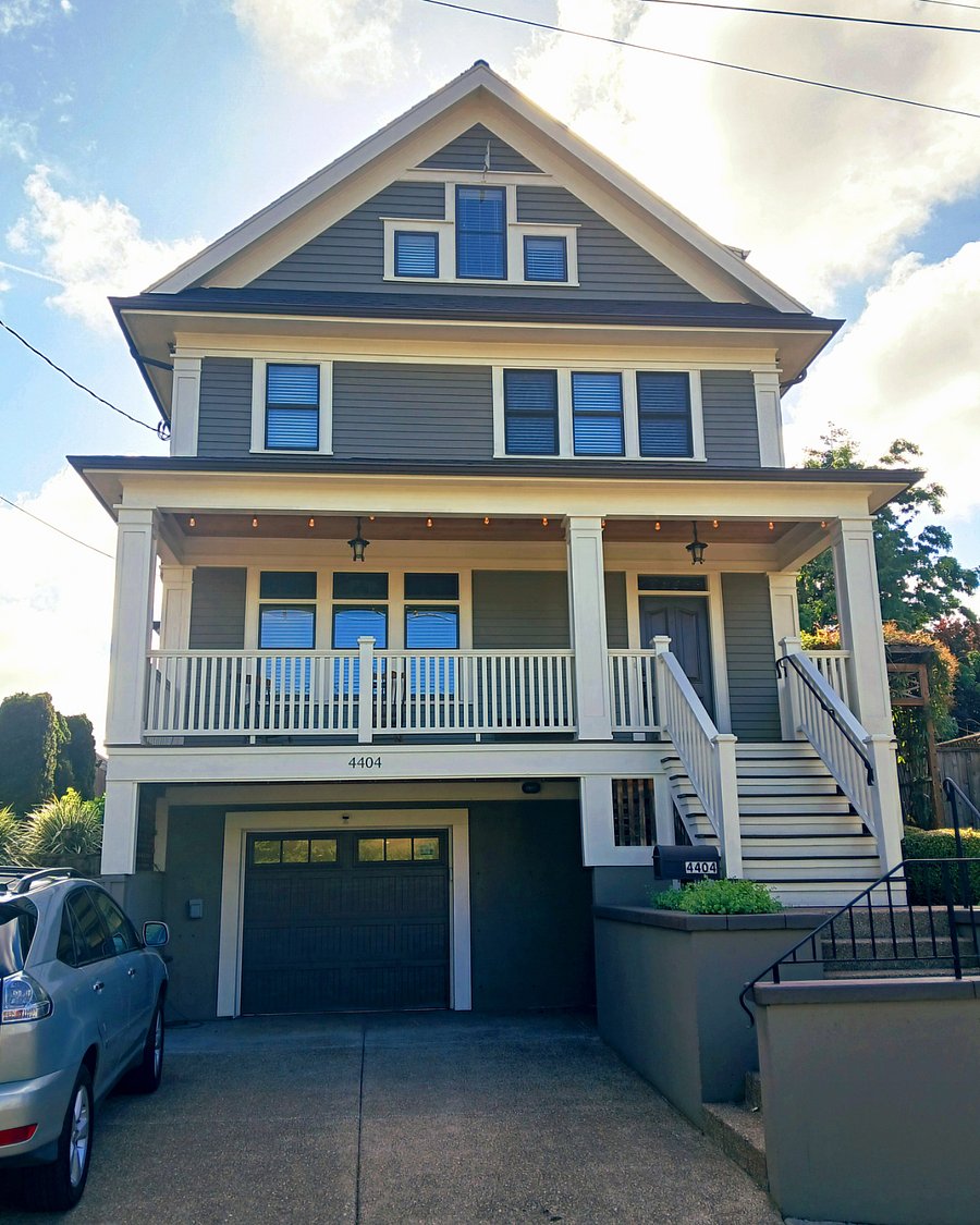 Front view with driveway and two shared off-street parking spots. Also lots of easy on-street parking on quiet street.