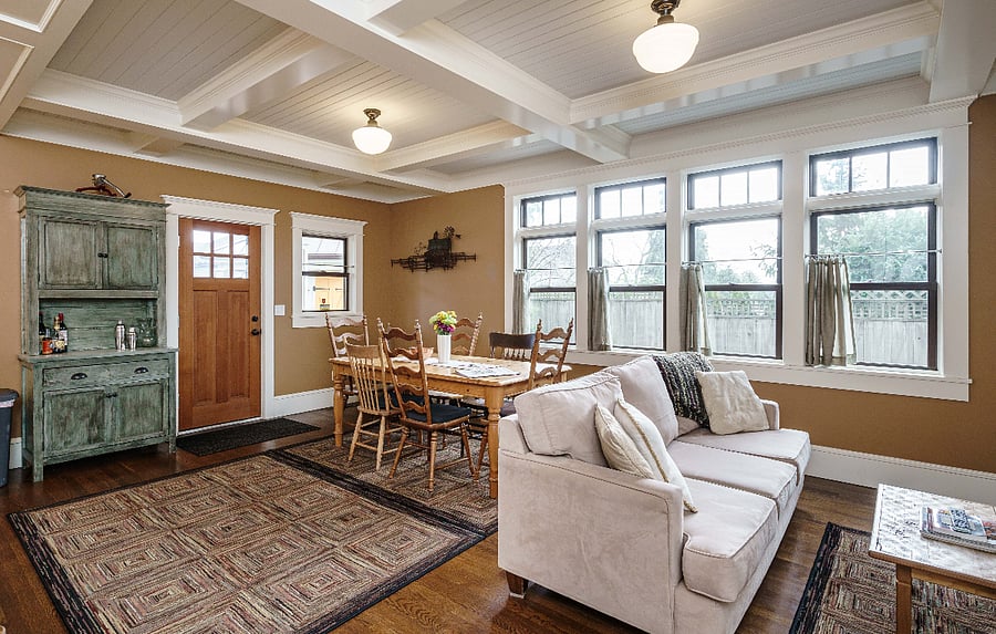 Kitchen farm table and sofa with door to back deck