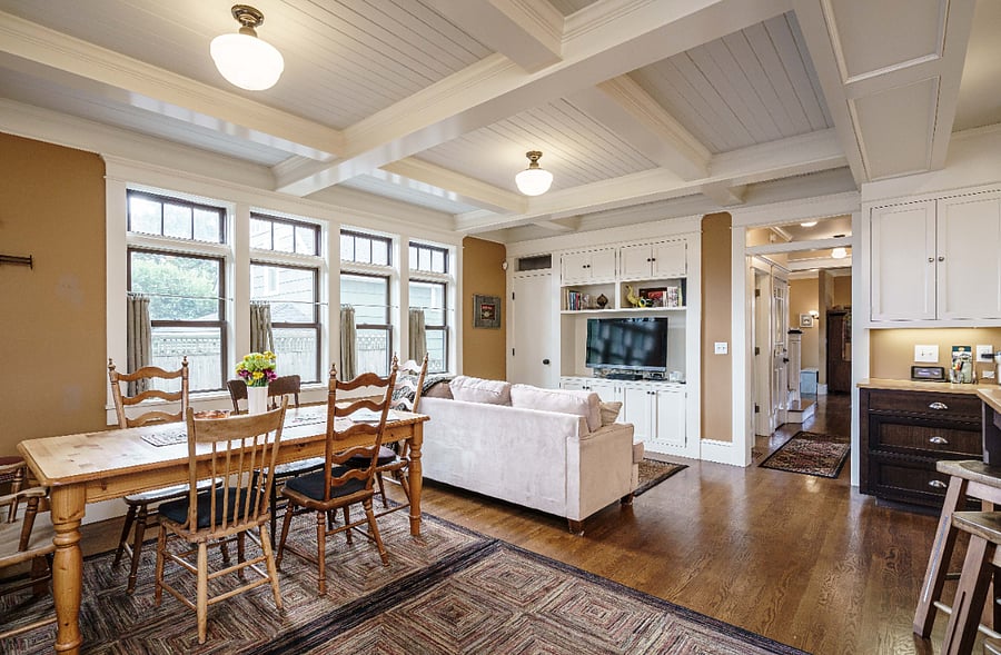 Kitchen farm table, sofa, TV and hall to powder room