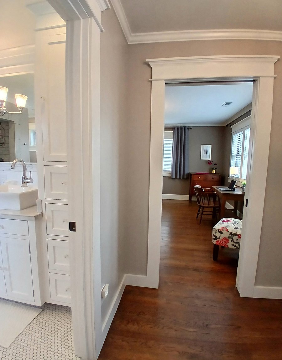 Main suite bathroom (to left) and bedroom (to right) as seen from walk-in closet