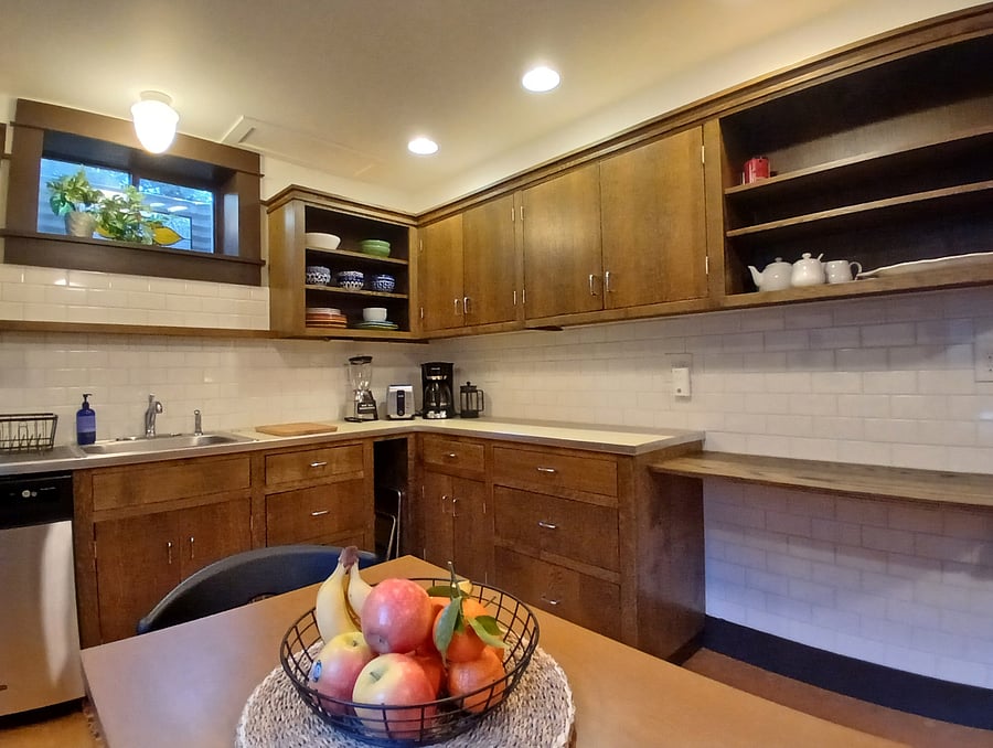 Well-equipped apartment kitchen with lots of counter space and eating area