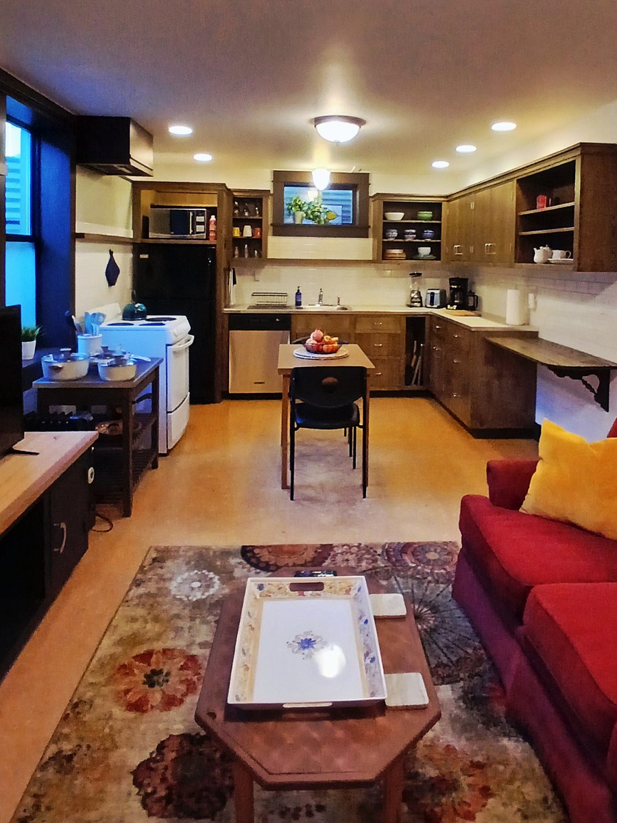 View from office/storage area into sitting area and kitchen
