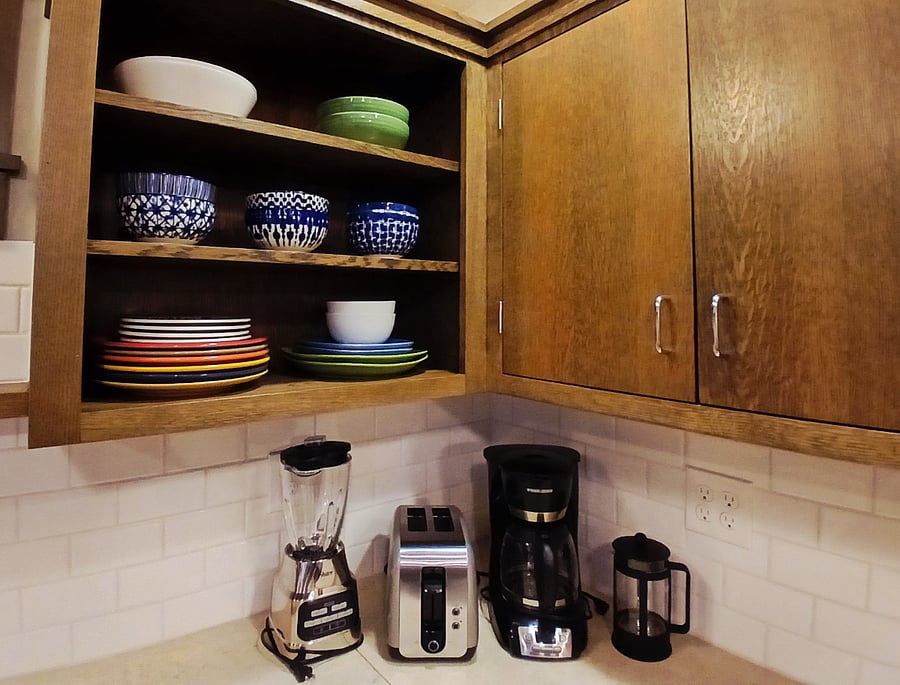 Kitchen features high-quality dishware, glassware, cookware, utensils and serving pieces