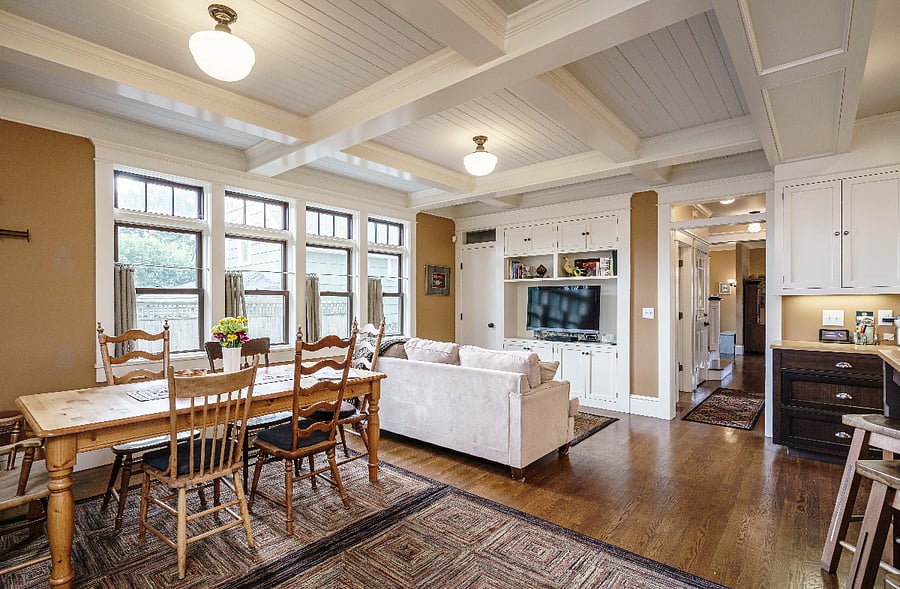 First-floor kitchen with farm table and sitting area with cable TV