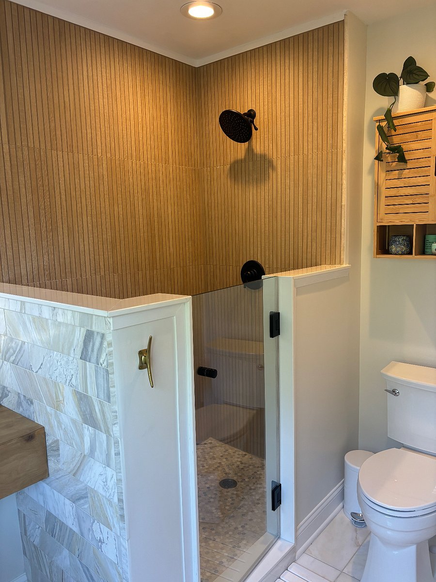 Third floor bathroom, newly installed in 2024, spa-like design w/ rain shower