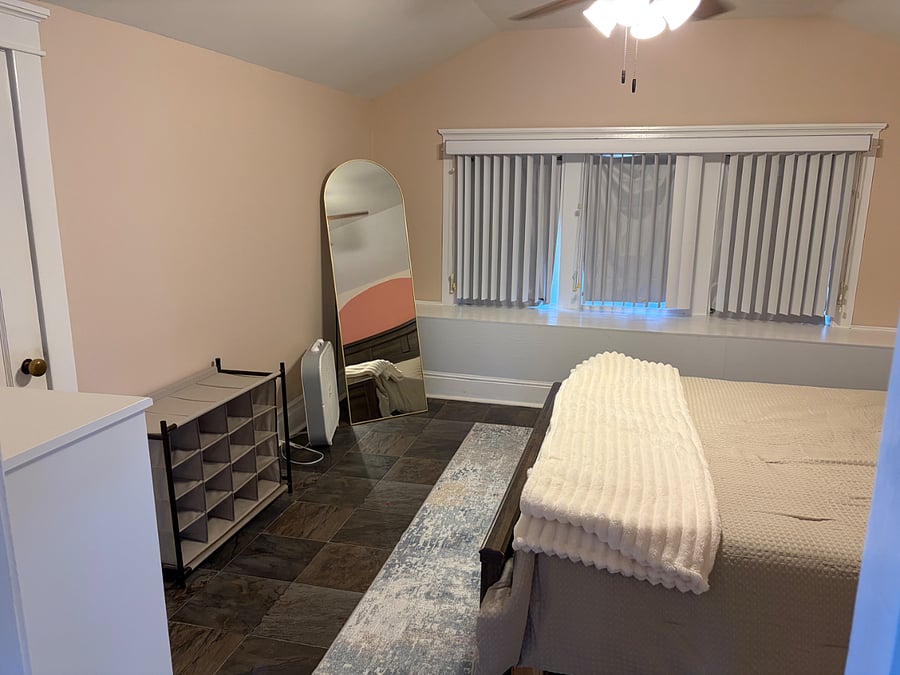 Bedroom with queen bed, variety of pillows with variable firmness.