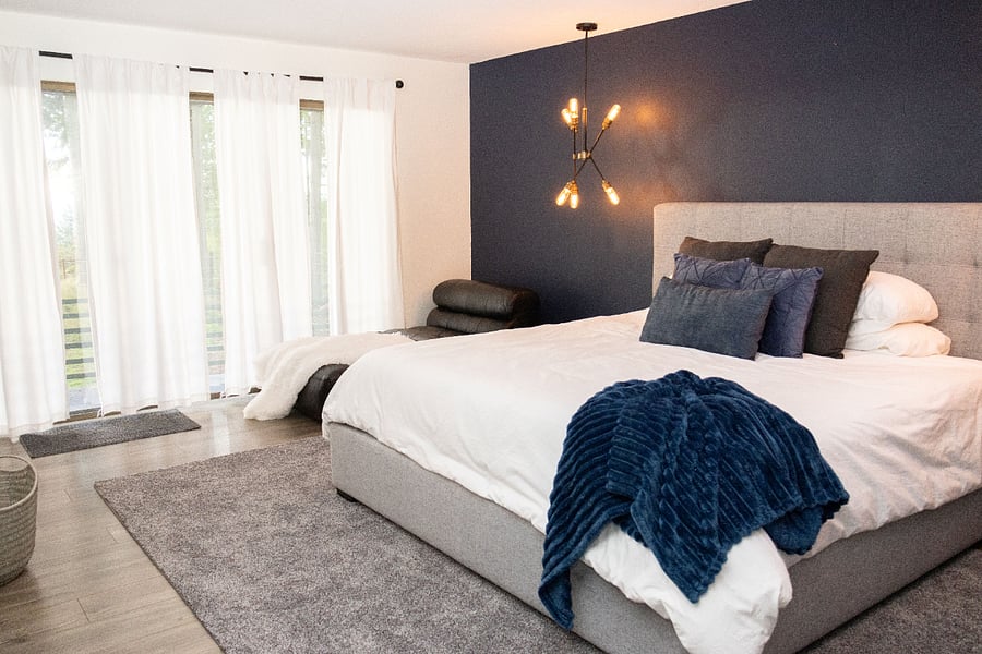 Main floor bedroom (King bed + balcony + bathroom w/shower)