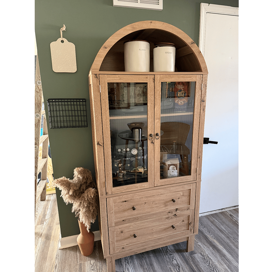 This cabinet serves as a pantry with a microwave inside.