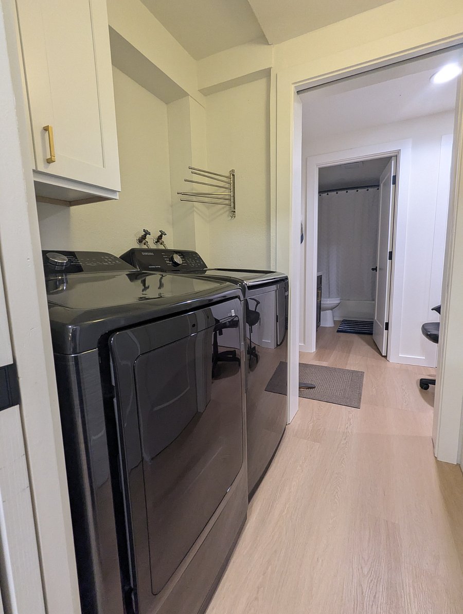 laundry room with new full size washer and dryer