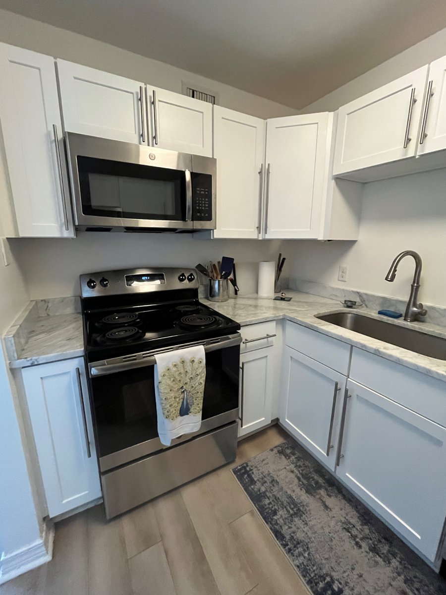 Fully equip kitchen, with electric stove, oven, and microwave
