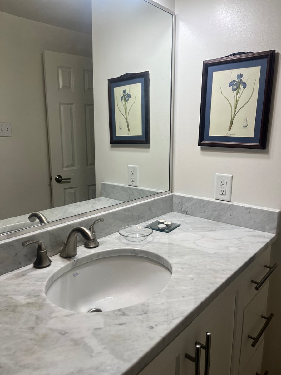 Bathroom vanity has lots of counter space. 
