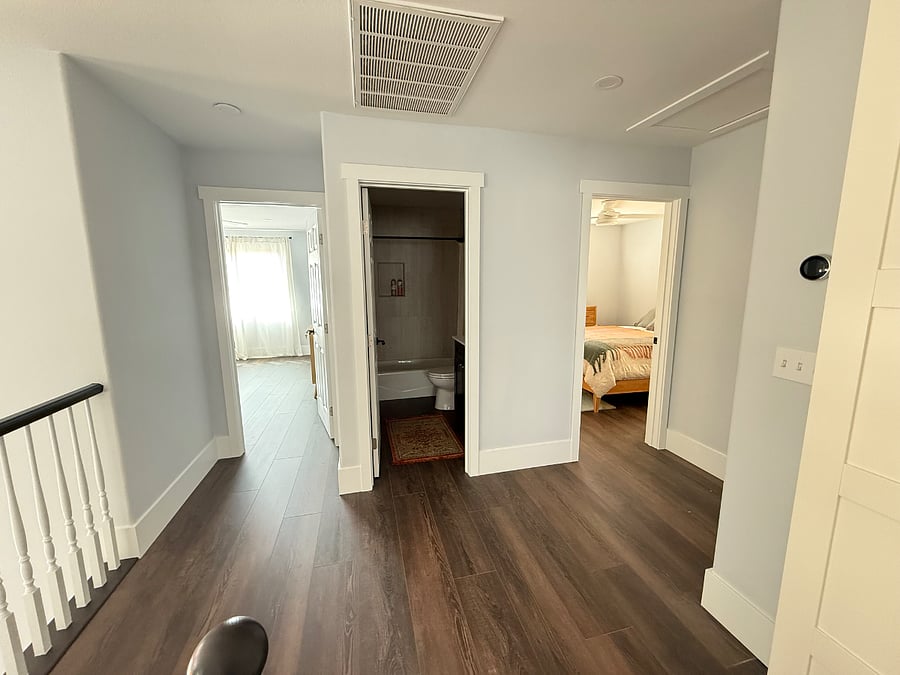 View of primary en suite room for rent (left), common area bath (middle), guest bedroom (right). Guest bedroom will typically remain empty.