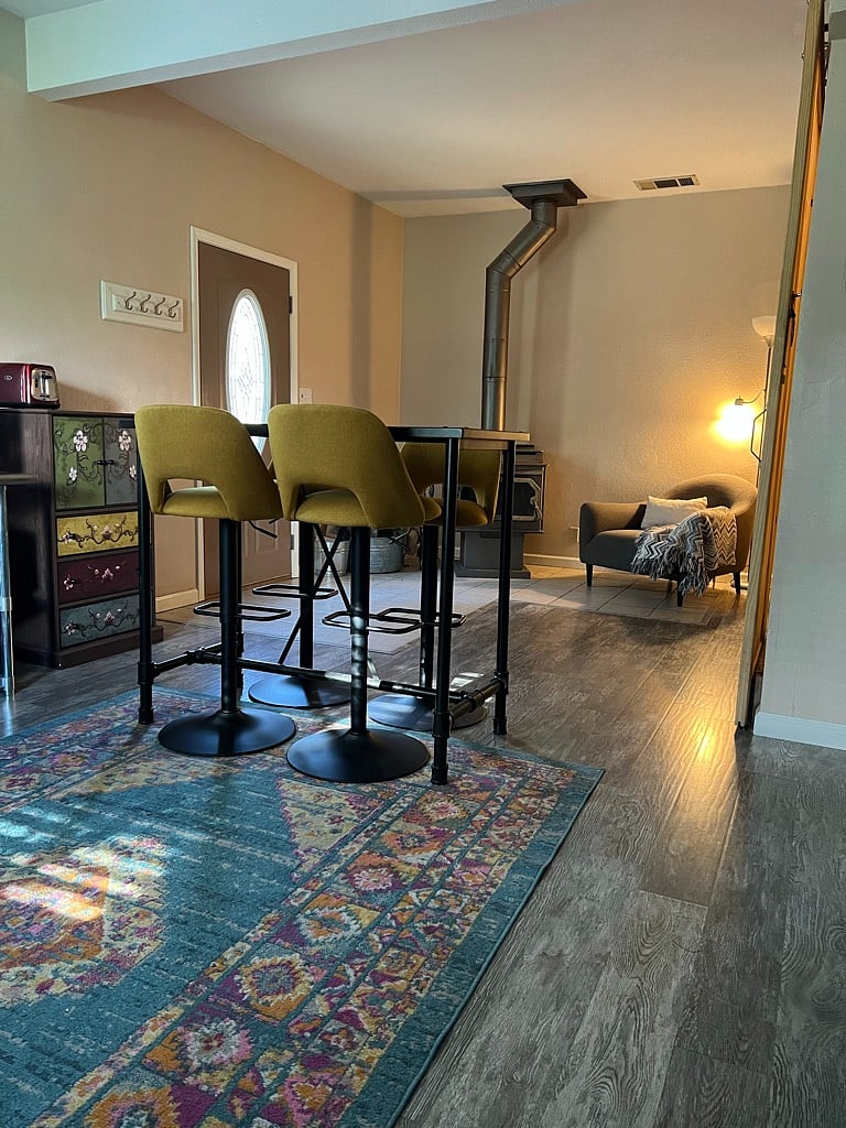 Bar table from kitchenette toward front door and woodstove