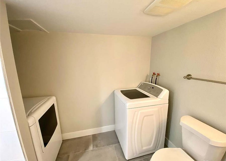 Downstairs laundry and bathroom with shower