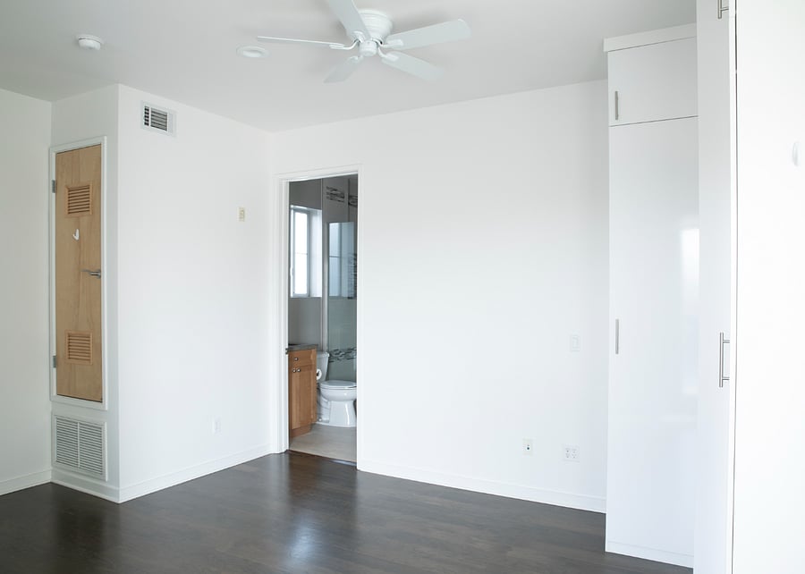I got these photos done before we furnished this room, but there is now a lovely bed and nightstand between the bathroom doorframe and the tall white closet on the right.
